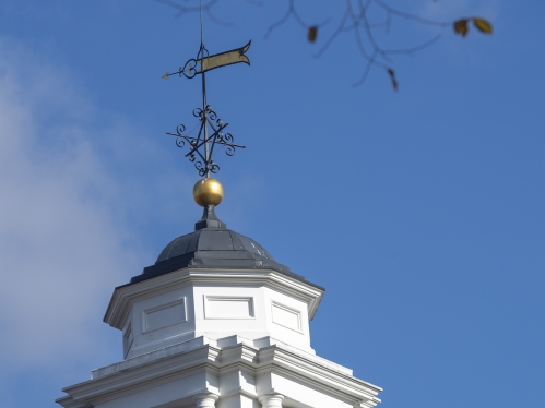 Cupola of Old Queens against a bright blue sky